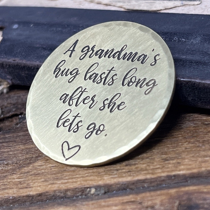 Brass pocket hug for grandchildren honoring grandmother