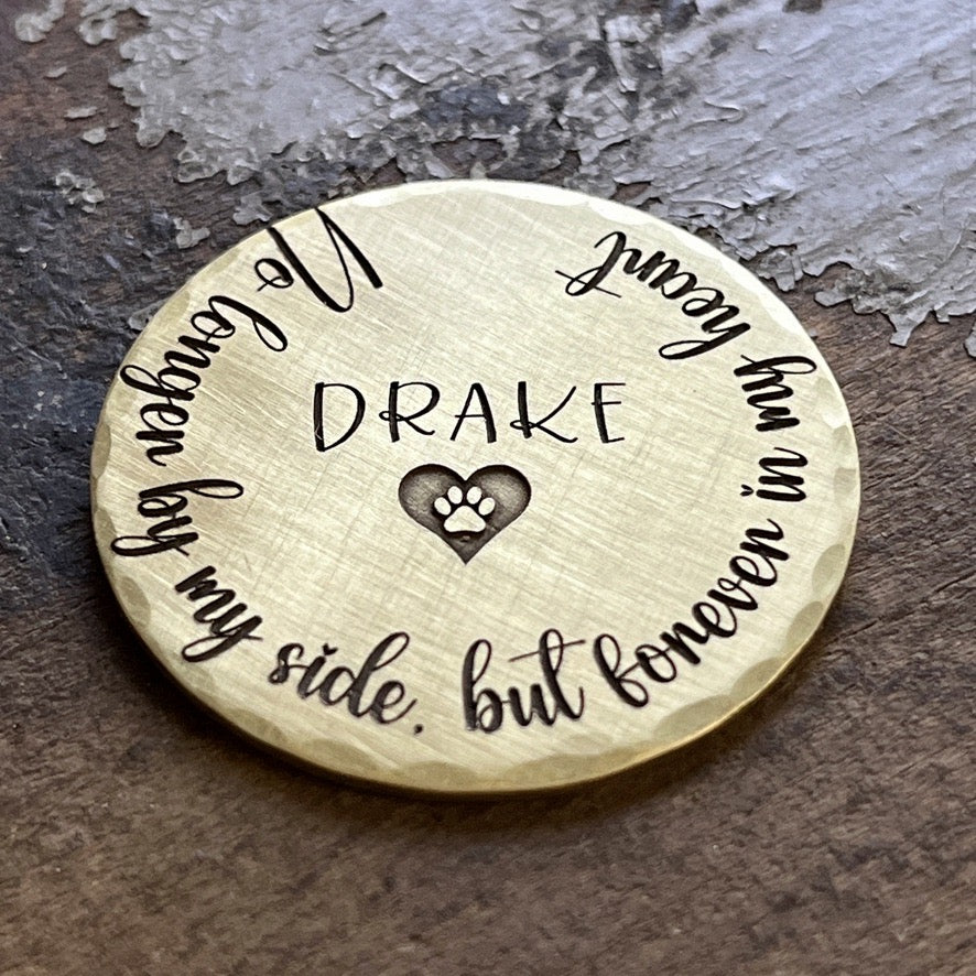 Engraved brass memorial coin for pet loss with paw print design
