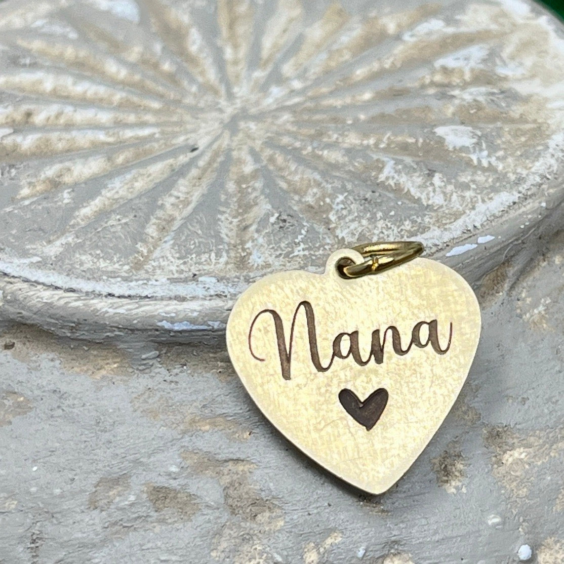 gold heart charm engraved with the name Nana and a heart