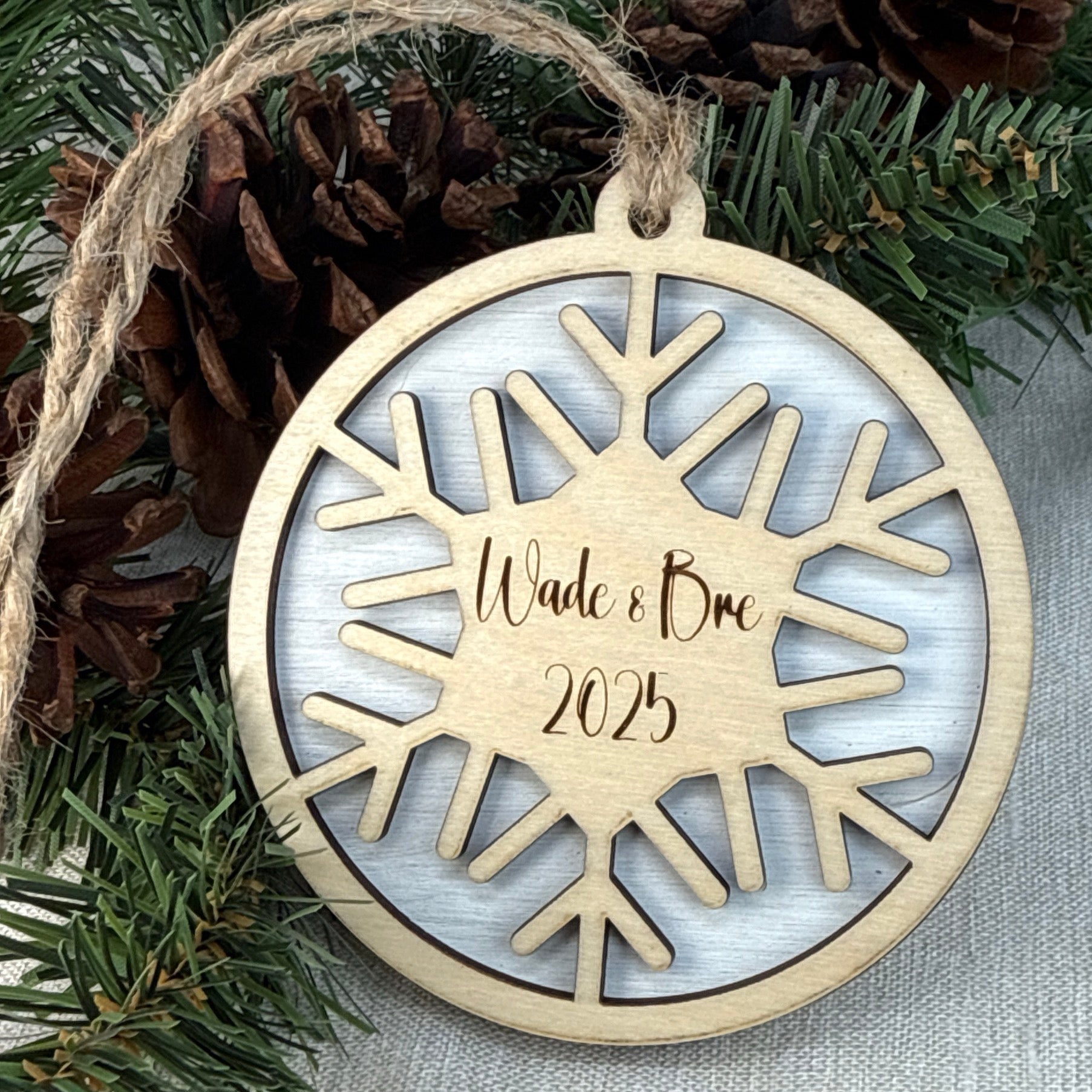 Personalized wooden snowflake ornament gift for Christmas tree decoration.