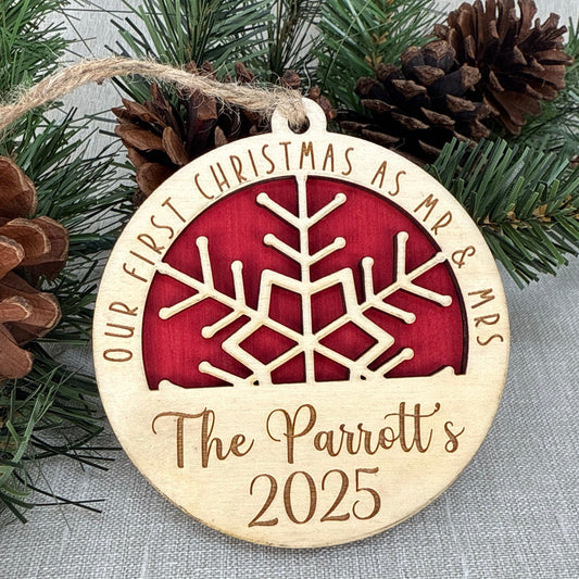 Personalized wood snowflake ornament for a couple’s first Christmas married.